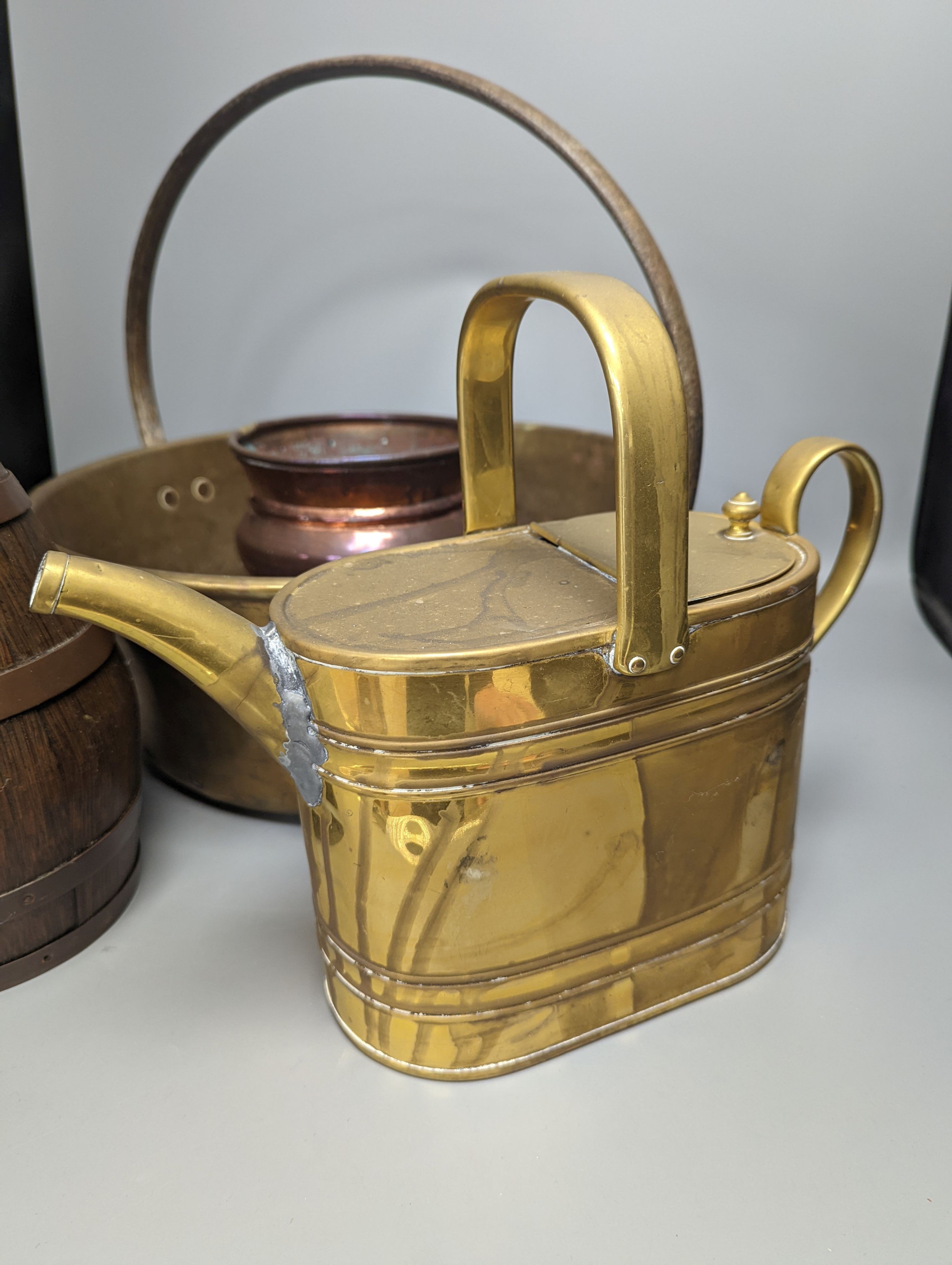 A studded copper pail, a coopered oak jug and other copper and brass wares, coopered jug 28cm high